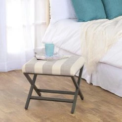 18 in. H x 20 in. W x 20 in. D Gray and Cream Awning Stripe Ottoman with Metal X-Base by Homepop 16 18 in. H x 20 in. W x 20 in. D Gray and Cream Awning Stripe Ottoman with Metal X-Base by Homepop -Homepop Sales gray and cream awning stripe with metal base homepop ottomans k7401 f2060 fa 1000